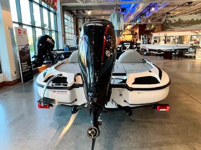 Slide: The Image of 2024 Nitro Z17 boat displayed indoors, showcasing rear view and motor. - 2