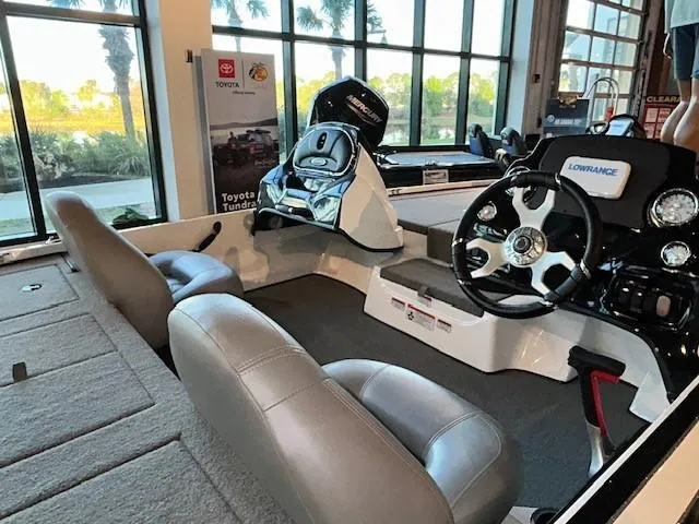 Slide: The Image of 2024 Nitro Z17 boat interior with steering wheel and seating, displayed indoors. - 3
