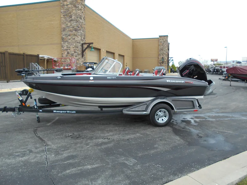 Slide: The Image of 2024 Ranger 1850MS boat on a trailer in a parking lot. - 2