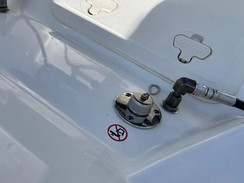 Slide: The Image of Fuel cap and connector on 2024 Boston Whaler 210 Montauk boat deck. - 13