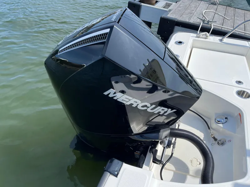 Slide: The Image of 2024 Boston Whaler 210 Montauk with Mercury outboard engine at dock. - 19