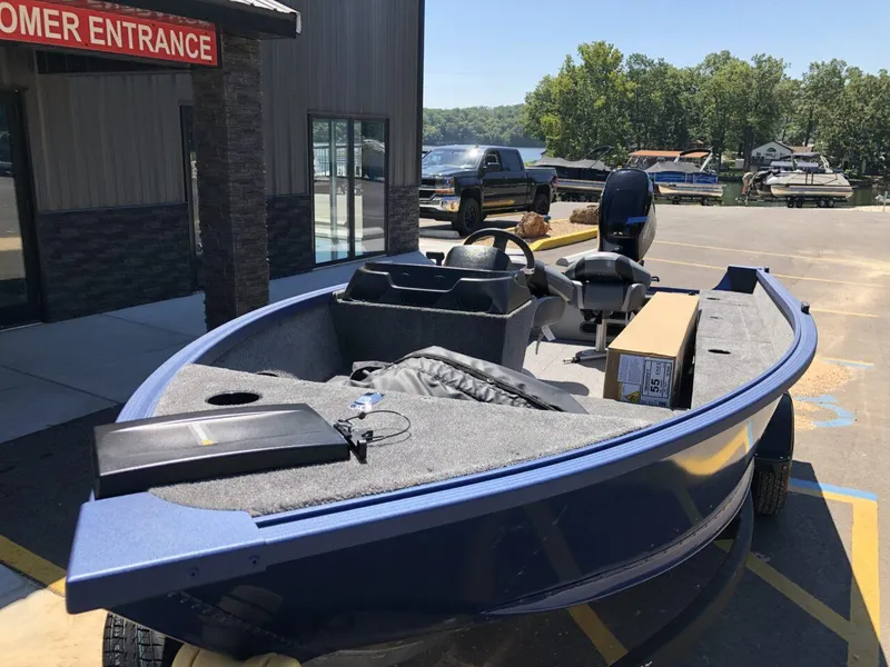 Slide: The Image of 2024 Alumacraft 165 Escape CS boat at dealership, front view. - 3