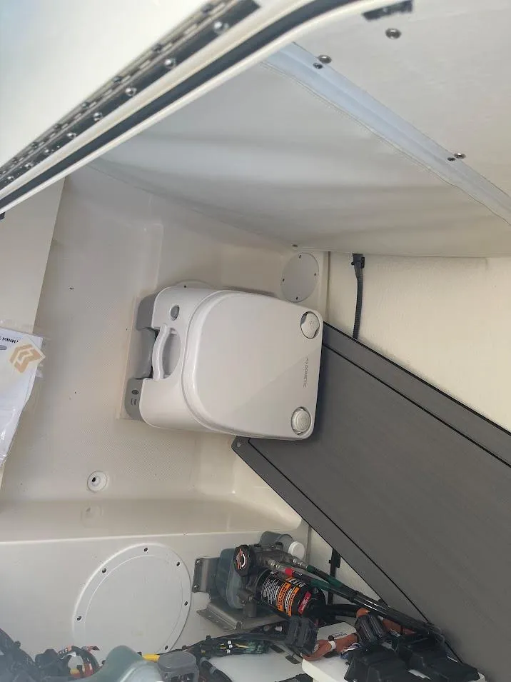 Slide: The Image of 2024 Sea Born LX 24 LE boat interior with portable toilet. - 11