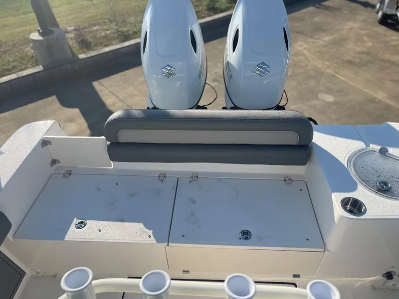 Slide: The Image of 2024 Sea Born LX 24 LE boat with dual outboard engines and fishing rod holders. - 12