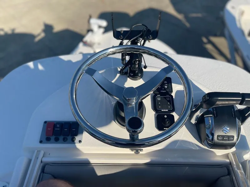 Slide: The Image of 2024 Sea Born LX 24 LE boat steering wheel and control panel. - 16