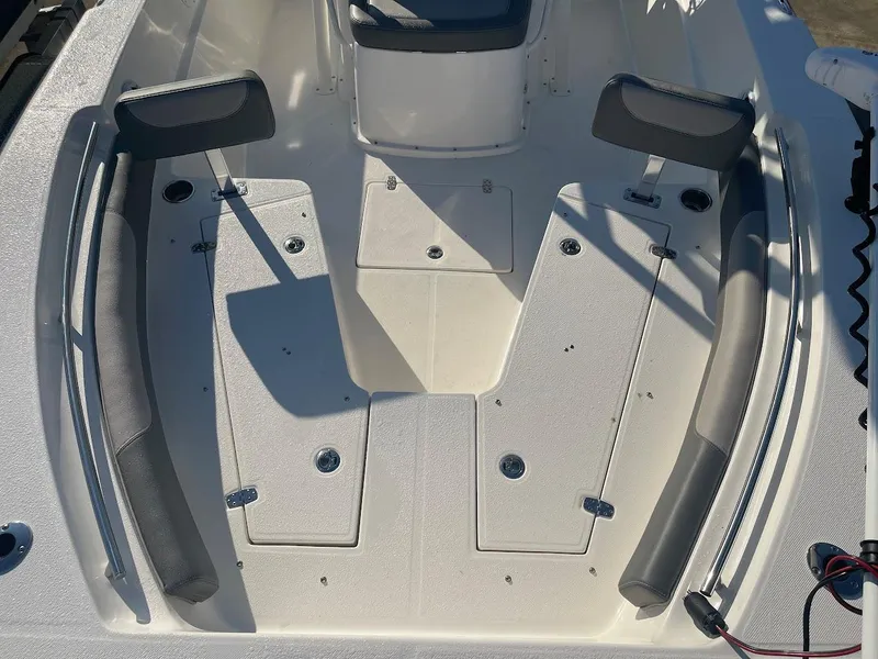 Slide: The Image of 2024 Sea Born LX 24 LE boat interior with seating and storage compartments. - 8