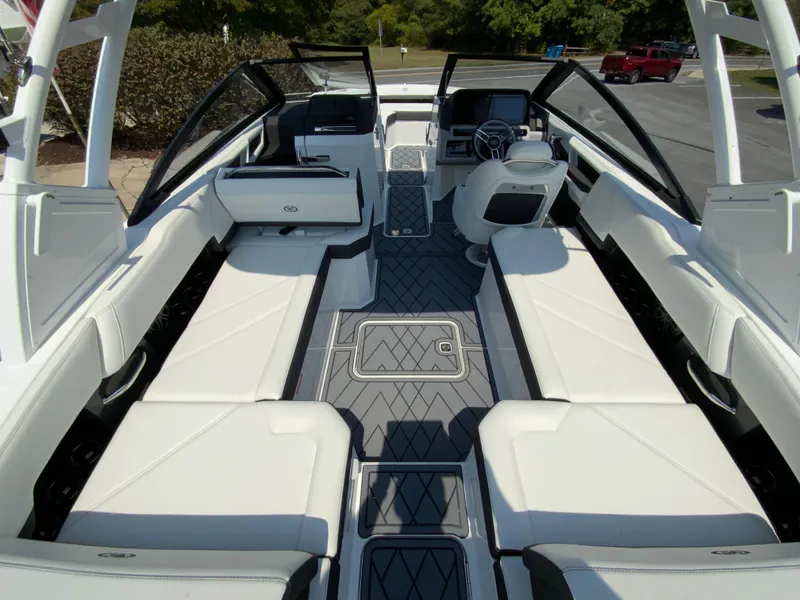 Slide: The Image of 2025 Cobalt R6 Outboard boat interior with sleek white seating and modern design. - 14