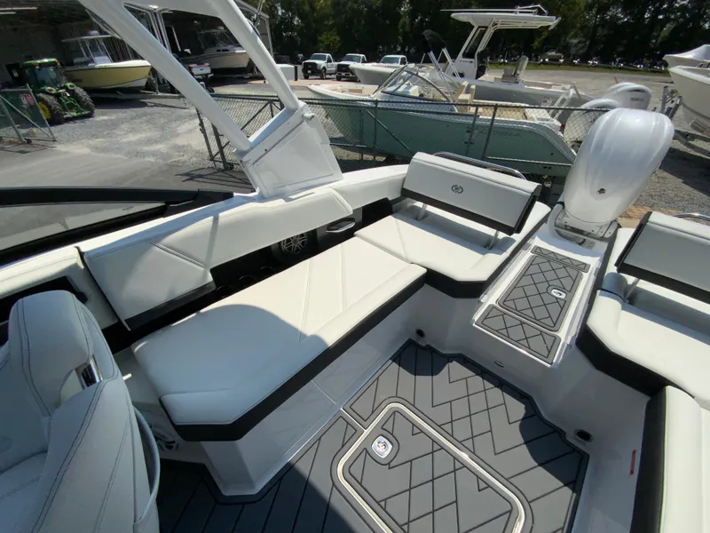 Slide: The Image of 2025 Cobalt R6 Outboard boat interior with white seating and modern design. - 18