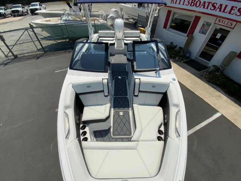 Slide: The Image of 2025 Cobalt R6 Outboard boat interior at dealership, featuring sleek seating and modern design. - 22