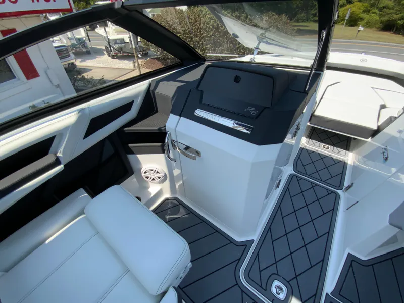 Slide: The Image of Interior of 2025 Cobalt R6 Outboard boat with modern seating and sleek design. - 24