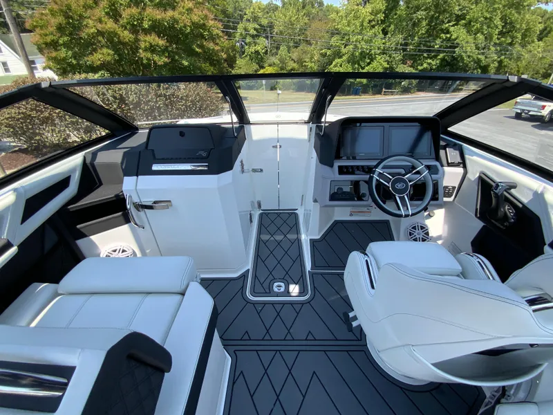 Slide: The Image of 2025 Cobalt R6 Outboard boat interior with modern dashboard and seating. - 26