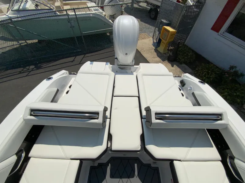 Slide: The Image of 2025 Cobalt R6 Outboard boat with sleek white seating and modern design. - 27