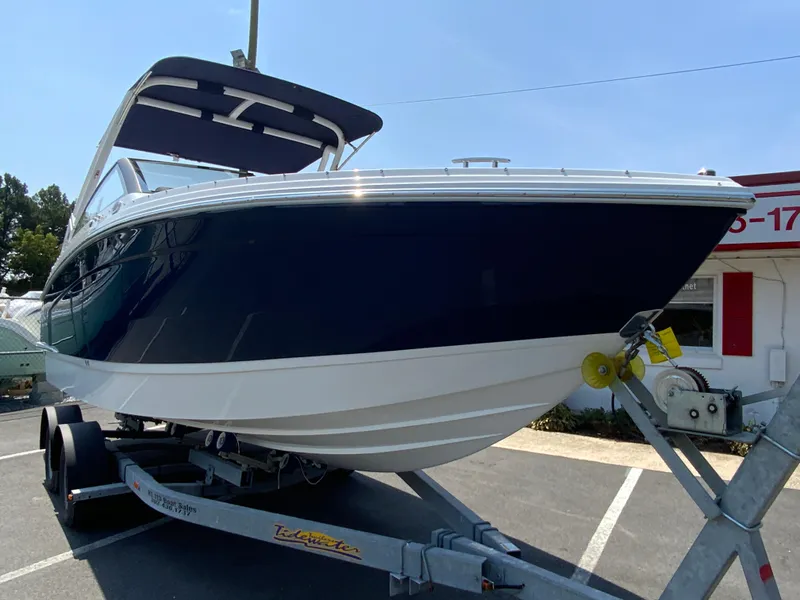 Slide: The Image of 2025 Cobalt R6 Outboard boat on trailer, parked outdoors. - 3