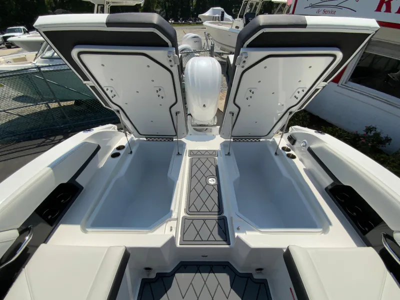 Slide: The Image of 2025 Cobalt R6 Outboard boat with open storage compartments, showcasing sleek design and functionality. - 31
