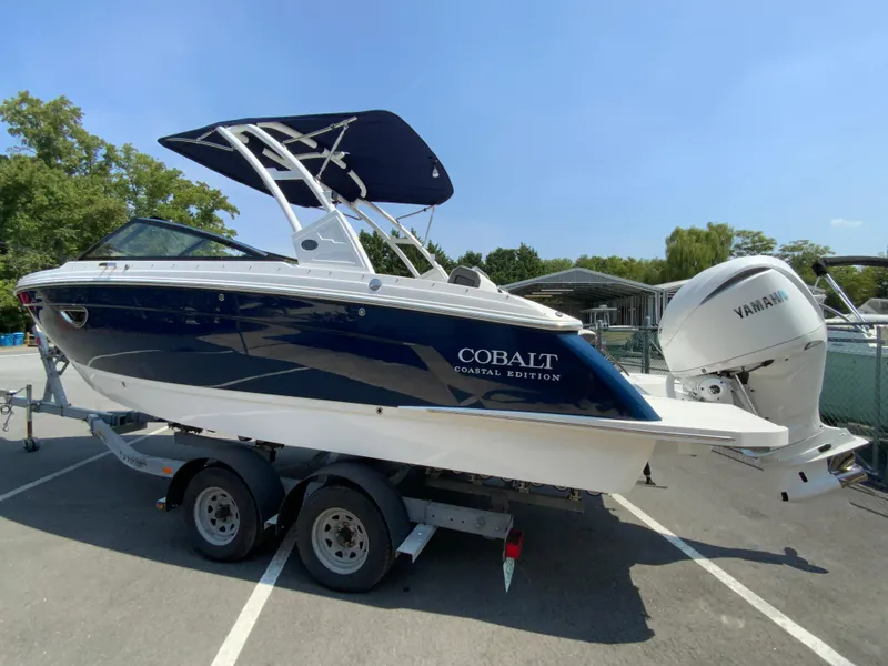 Slide: The Image of 2025 Cobalt R6 Outboard boat on trailer, featuring sleek design and Yamaha engine. - 7