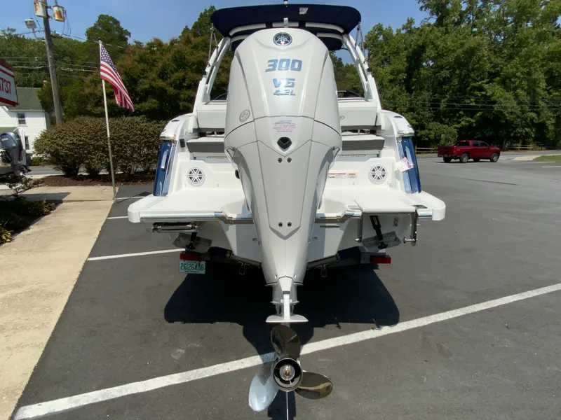 Slide: The Image of 2025 Cobalt R6 Outboard boat with powerful engine, parked outdoors. - 9
