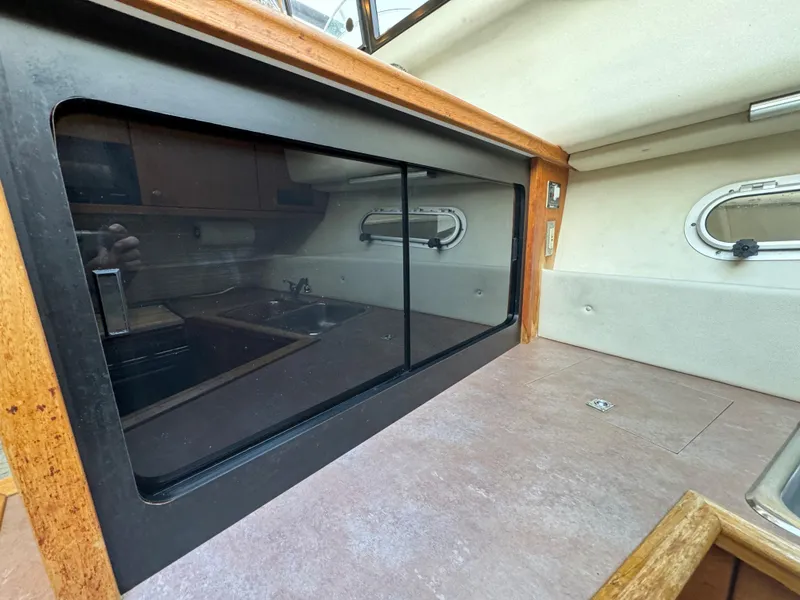 Slide: The Image of Interior view of 1996 Bayliner 3388 Command Bridge Motoryacht kitchen area. - 13