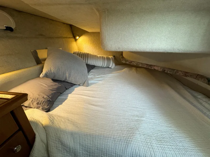 Slide: The Image of Cozy sleeping quarters in a 1996 Bayliner 3388 Command Bridge Motoryacht. - 20