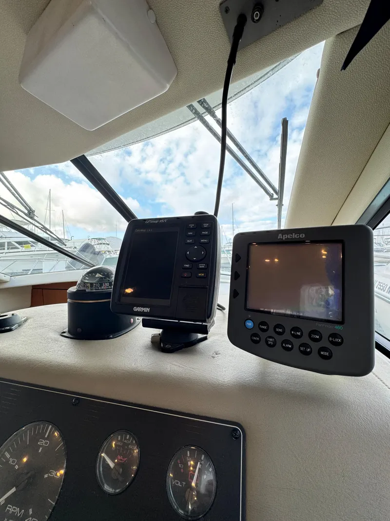 Slide: The Image of 1996 Bayliner 3388 Command Bridge Motoryacht helm with Garmin and Apelco navigation systems. - 25