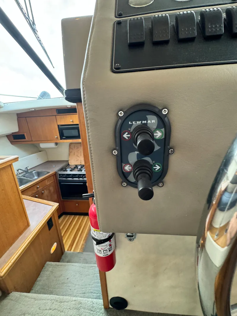 Slide: The Image of 1996 Bayliner 3388 Command Bridge Motoryacht interior helm controls and galley. - 26
