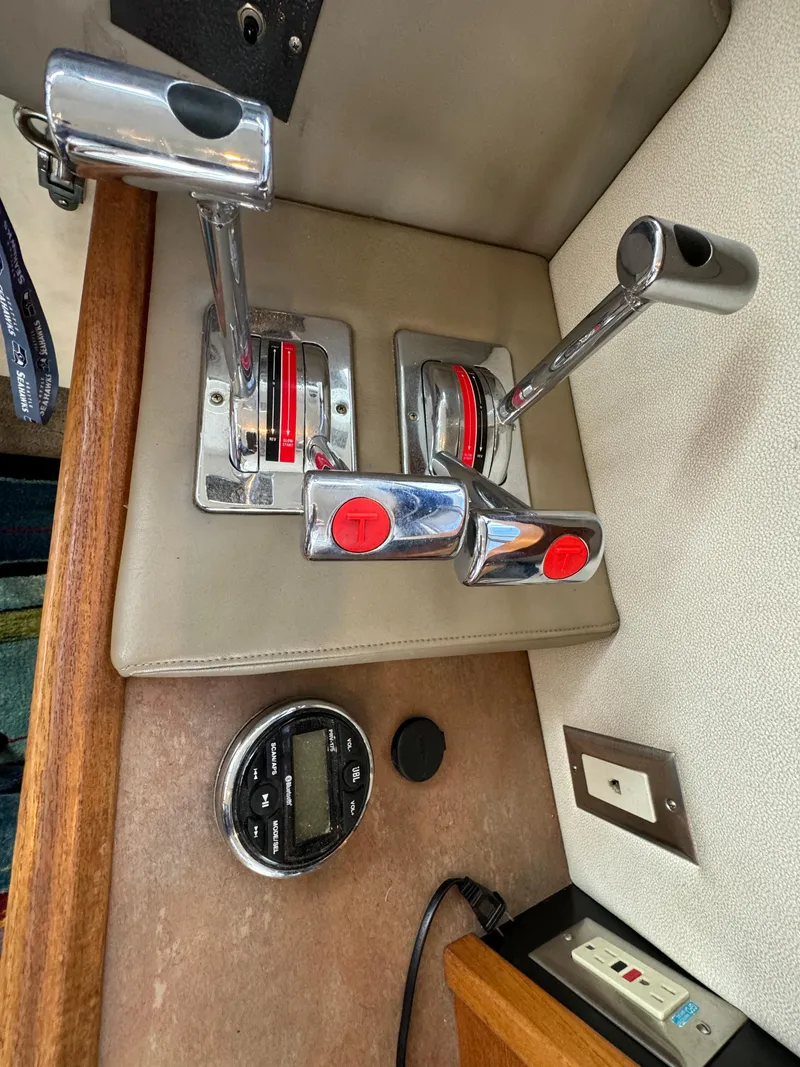 Slide: The Image of 1996 Bayliner 3388 Command Bridge Motoryacht throttle controls and instrumentation. - 27