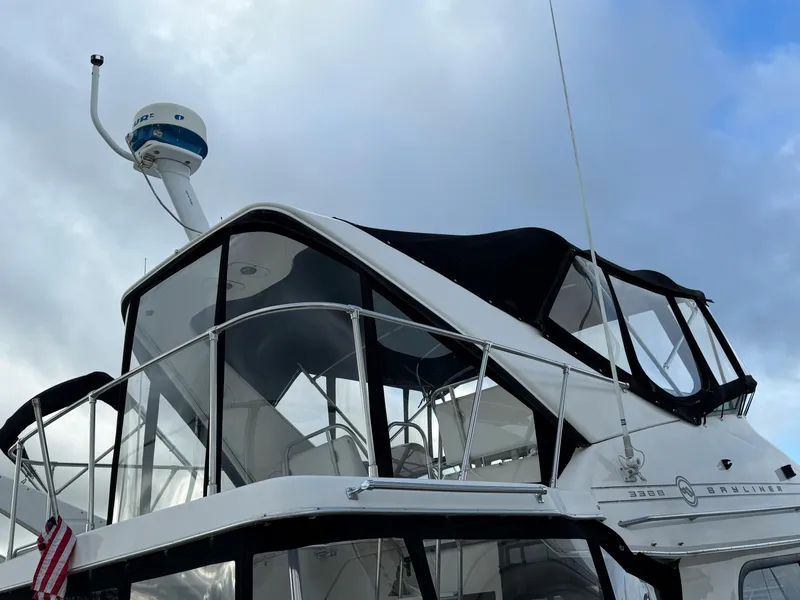 Slide: The Image of 1996 Bayliner 3388 Command Bridge Motoryacht with radar and enclosed bridge. - 3