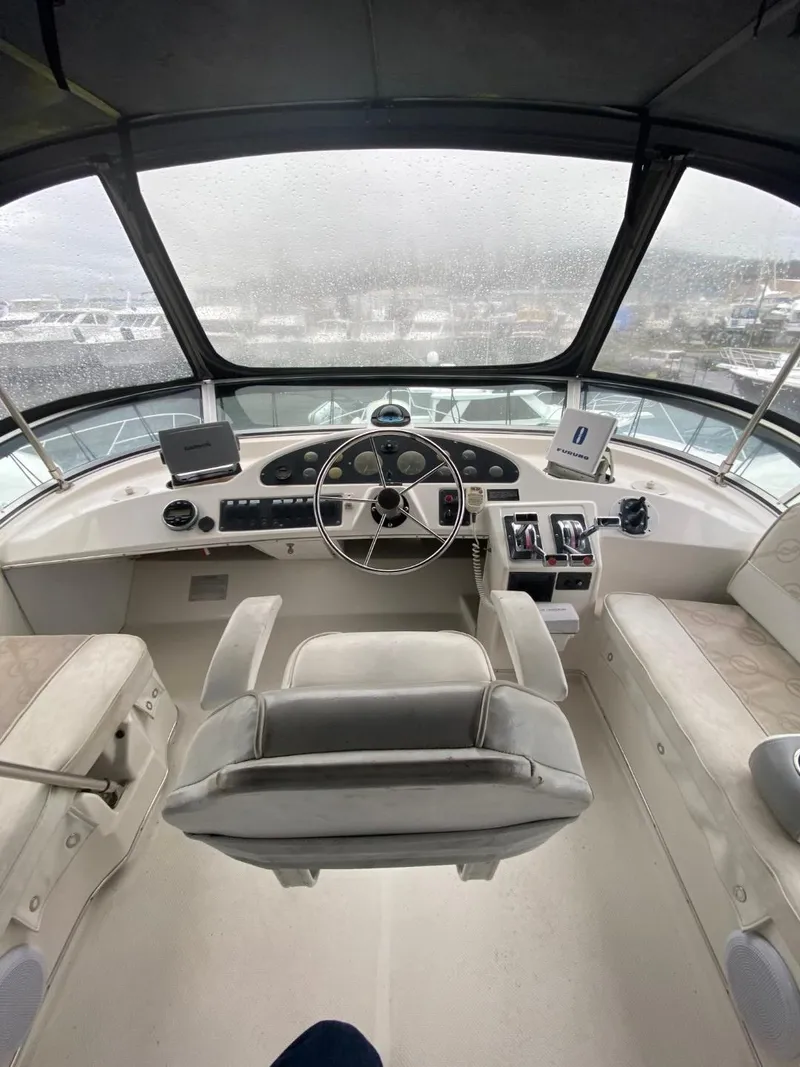 Slide: The Image of 1996 Bayliner 3388 Command Bridge Motoryacht helm with panoramic view. - 34