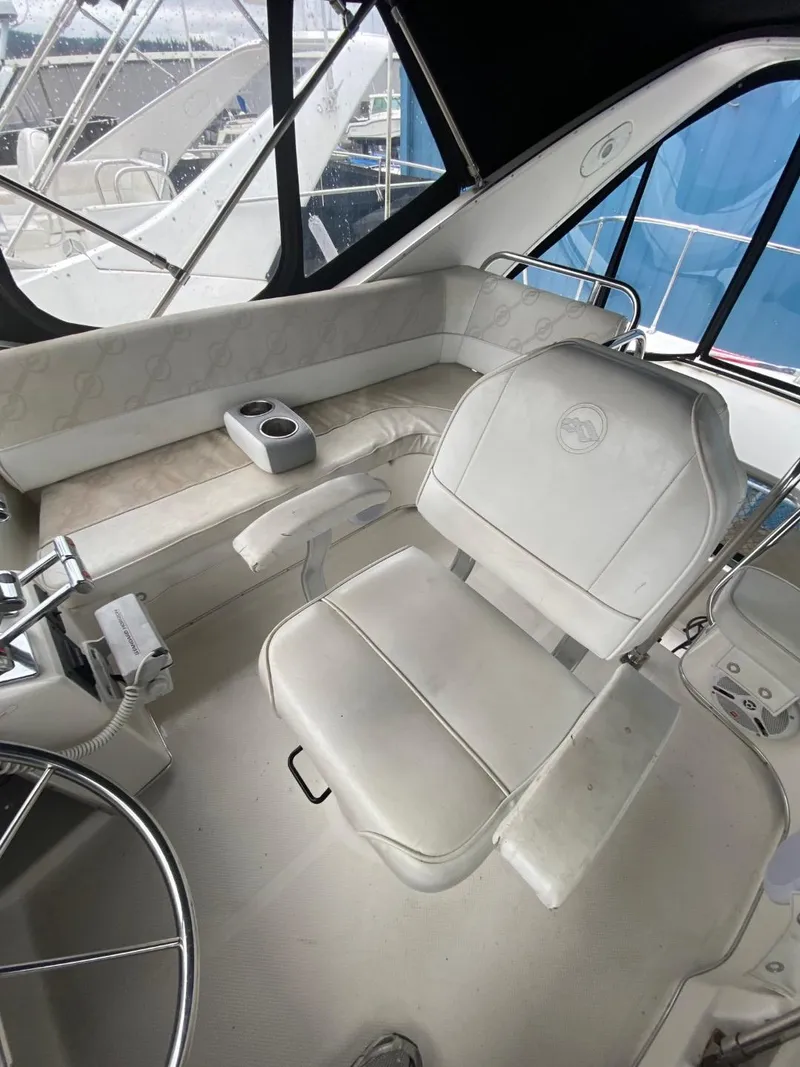 Slide: The Image of 1996 Bayliner 3388 Command Bridge Motoryacht helm station with captain's chair. - 35