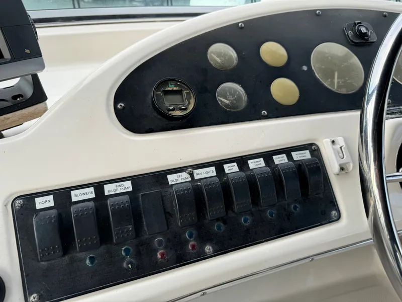 Slide: The Image of Control panel of a 1996 Bayliner 3388 Command Bridge Motoryacht with switches and gauges. - 39