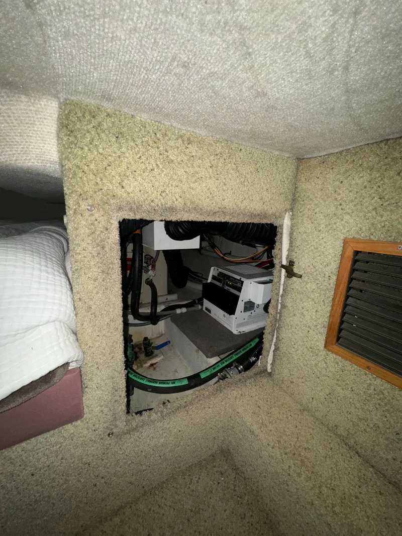 Slide: The Image of 1996 Bayliner 3388 Command Bridge Motoryacht interior compartment with equipment. - 47