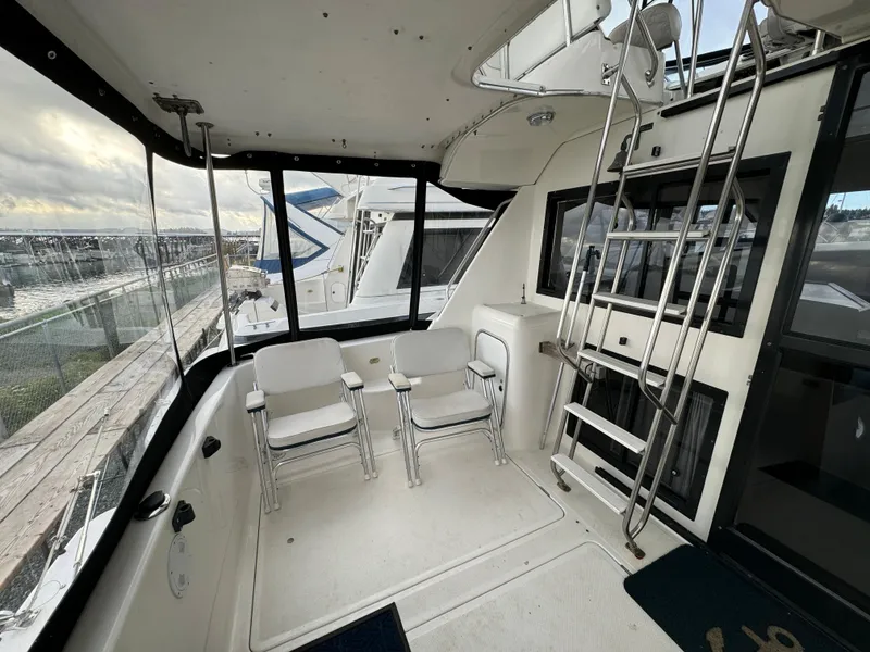 Slide: The Image of 1996 Bayliner 3388 Command Bridge Motoryacht interior with seating and ladder. - 5