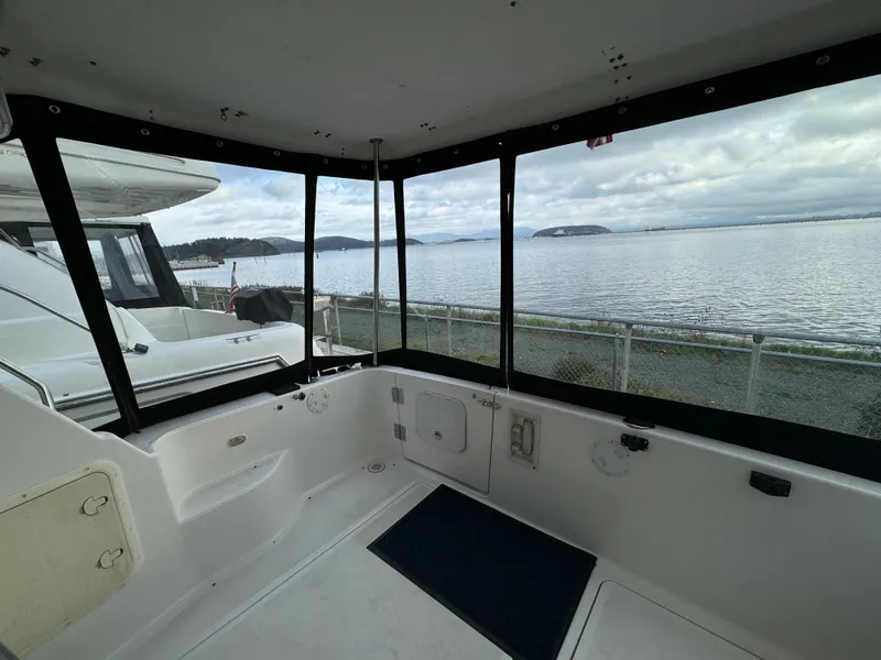 Slide: The Image of 1996 Bayliner 3388 Command Bridge Motoryacht interior with scenic water view. - 7