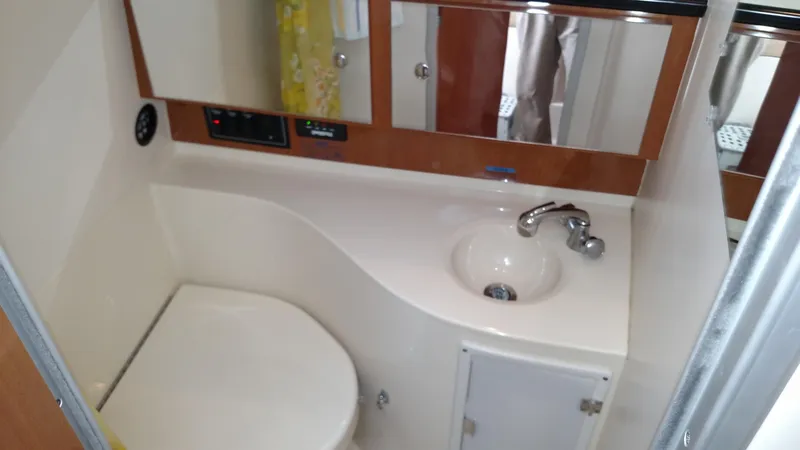 Slide: The Image of Interior of 2004 Wellcraft 330 Coastal with cozy sleeping area. - 11