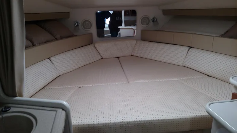 Slide: The Image of 2004 Wellcraft 330 Coastal boat helm with gauges and controls. - 15