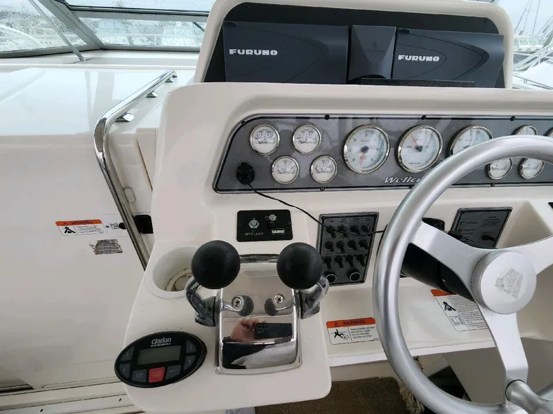Slide: The Image of Interior view of a 2004 Wellcraft 330 Coastal boat deck. - 19