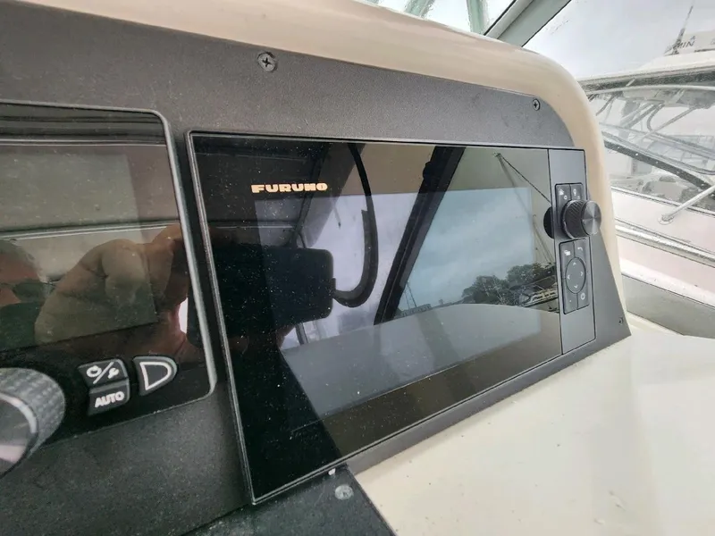 Slide: The Image of 2004 Wellcraft 330 Coastal boat on a dry dock. - 21