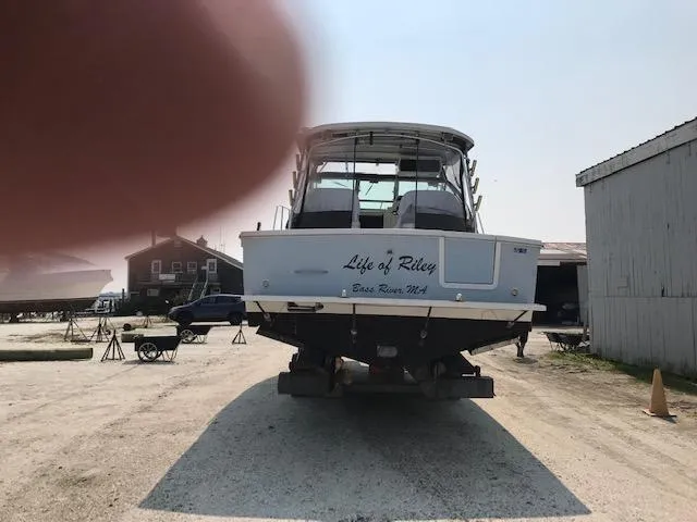 Slide: The Image of Wellcraft 330 Coastal 2004 anchor chain and winch on deck. - 26