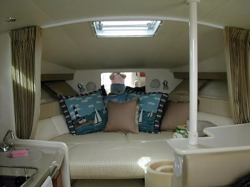 Slide: The Image of Interior of 2004 Wellcraft 330 Coastal with cozy cushions. - 3