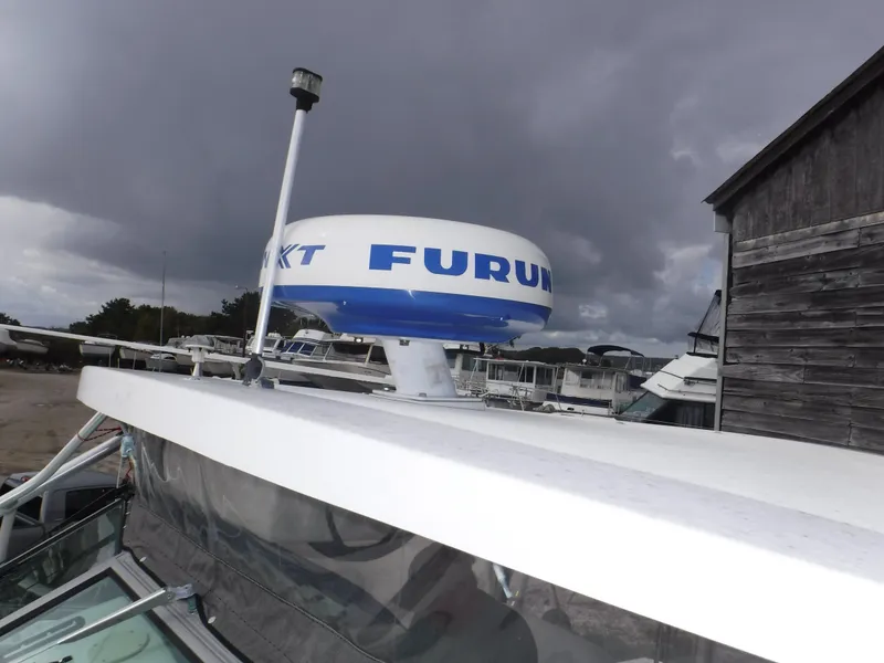 Slide: The Image of Dashboard of a 2004 Wellcraft 330 Coastal with navigation systems. - 30