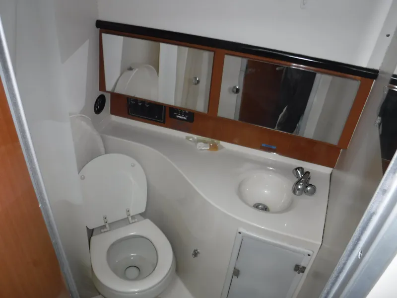 Slide: The Image of 2004 Wellcraft 330 Coastal boat elevated for maintenance. - 40