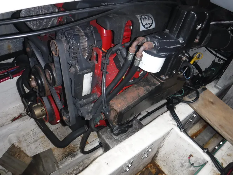 Slide: The Image of 2004 Wellcraft 330 Coastal boat docked at marina, named "Life of Riley." - 42