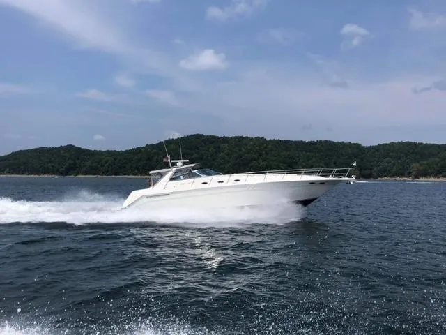 The Image of 1997 Sea Ray 500 Sundancer cruising on open water. - 0