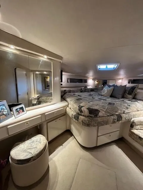 Slide: The Image of Luxurious bedroom interior of a 1997 Sea Ray 500 Sundancer yacht. - 11