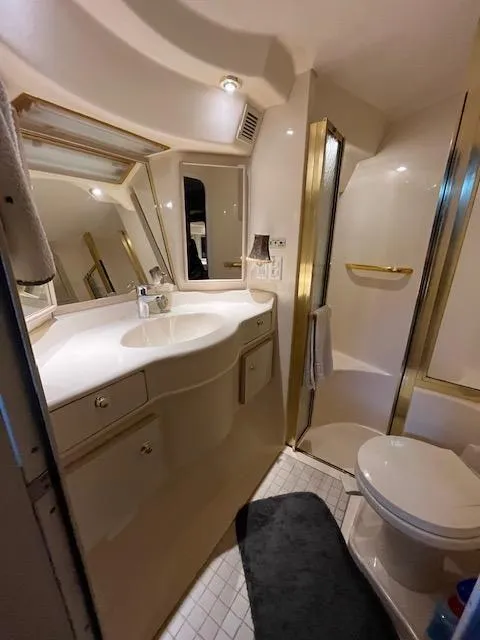 Slide: The Image of 1997 Sea Ray 500 Sundancer bathroom with modern fixtures and shower. - 12