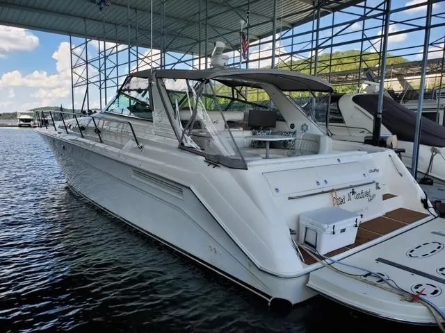 Slide: The Image of 1997 Sea Ray 500 Sundancer yacht docked in a marina. - 2