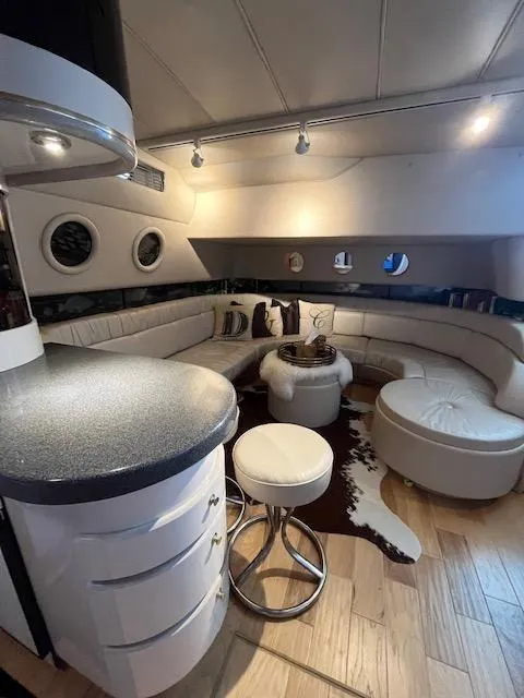Slide: The Image of Luxurious interior of a 1997 Sea Ray 500 Sundancer yacht with modern seating and stylish decor. - 20