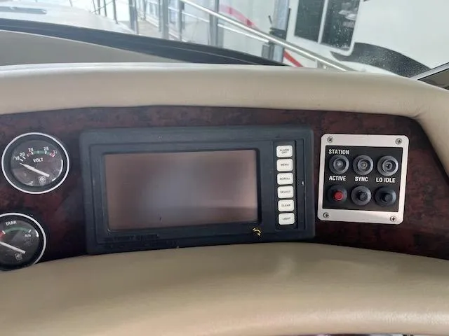 Slide: The Image of Control panel of a 1997 Sea Ray 500 Sundancer yacht with gauges and buttons. - 5