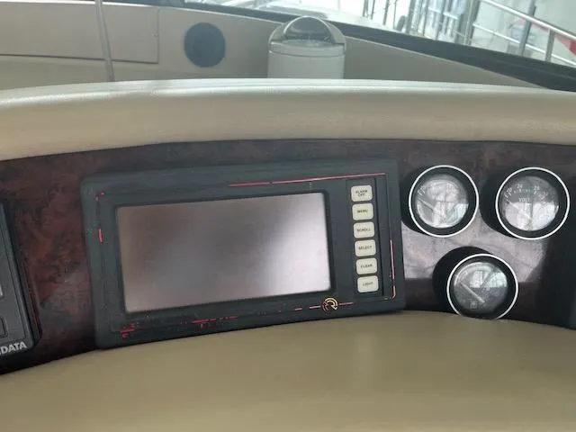 Slide: The Image of Dashboard of a 1997 Sea Ray 500 Sundancer boat with navigation system. - 6