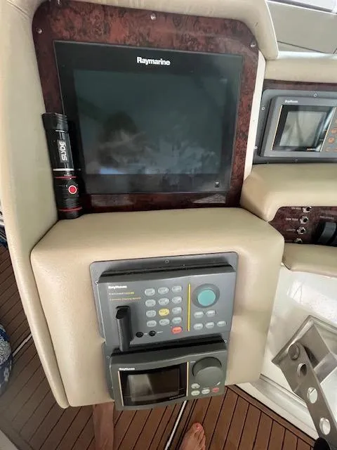 Slide: The Image of Control panel of a 1997 Sea Ray 500 Sundancer yacht with Raymarine electronics. - 7
