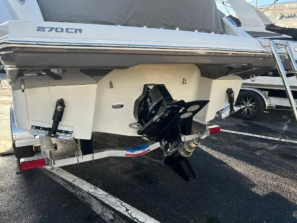 Slide: The Image of 2024 Crownline 270 CR boat stern view with outboard motor. - 3